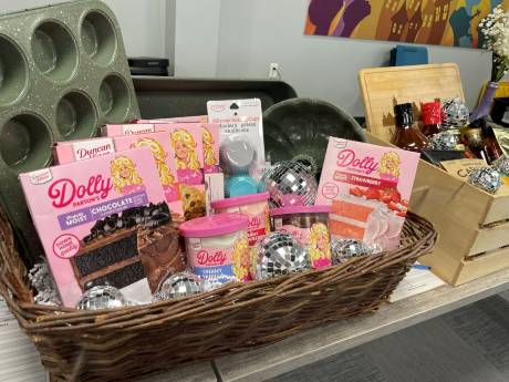 A basket of Dolly Parton cake mixes and disco balls.